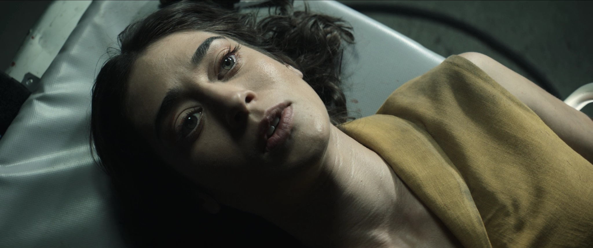 Lizzy Caplan never makes it through an alien invasion unscathed